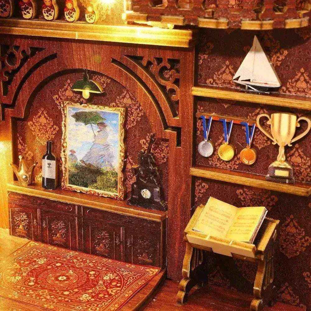Library of Books miniature wall display with framed art, medals, a trophy and a model sailboat.
