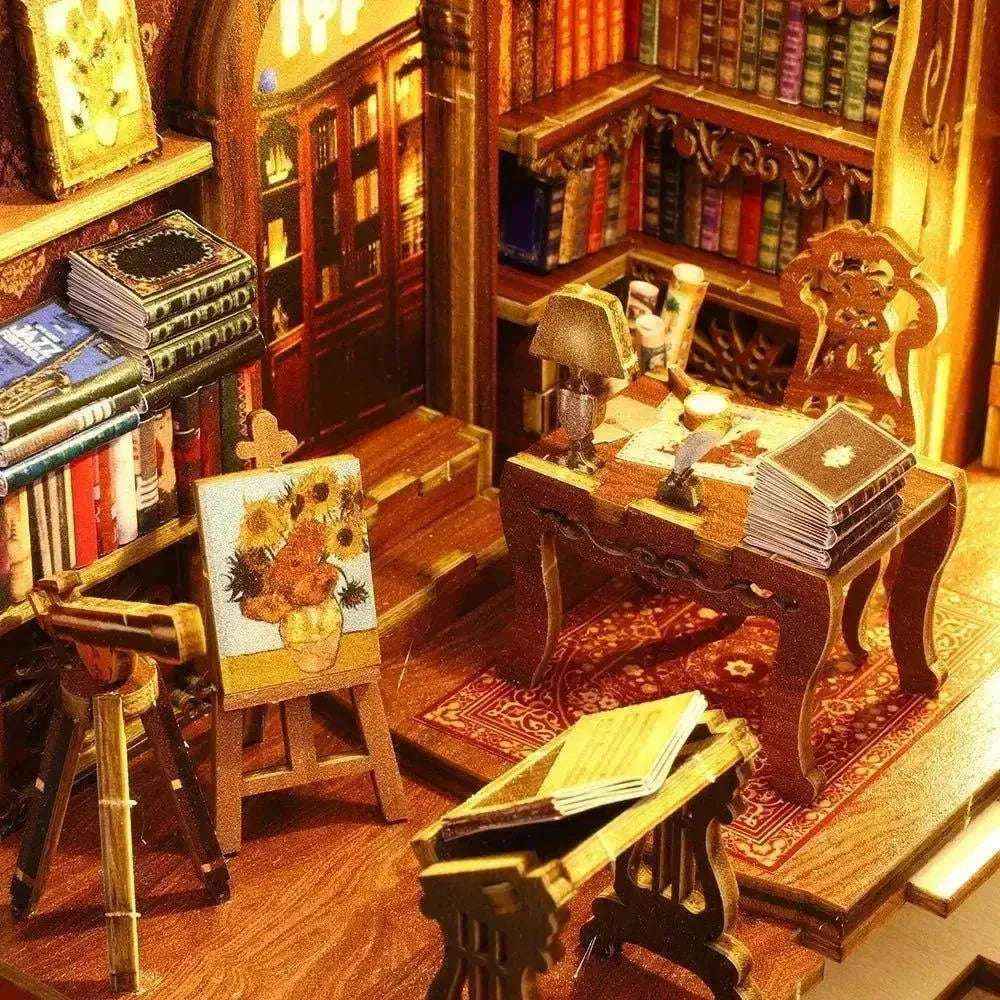Miniature study desk, easel and bookshelves inside the Library of Books book nook.