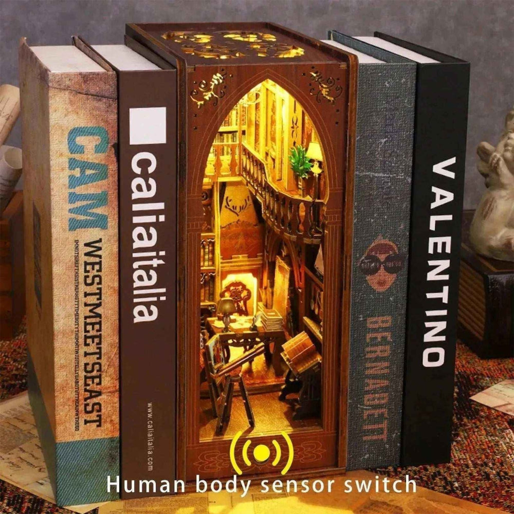 Illuminated Library of Books book nook with a pointed arch, displayed between full-size books.