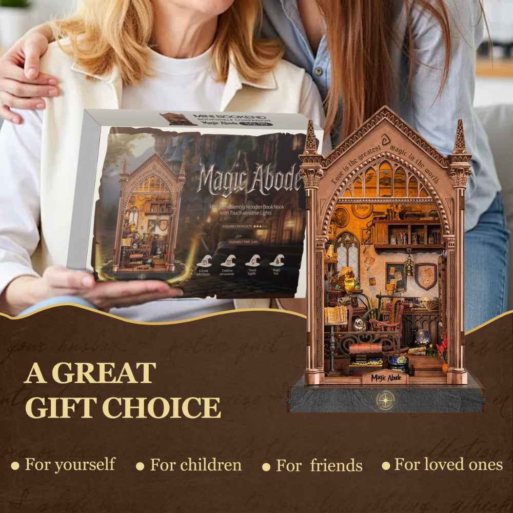 Two people holding a Magic Abode kit box beside the assembled book nook.