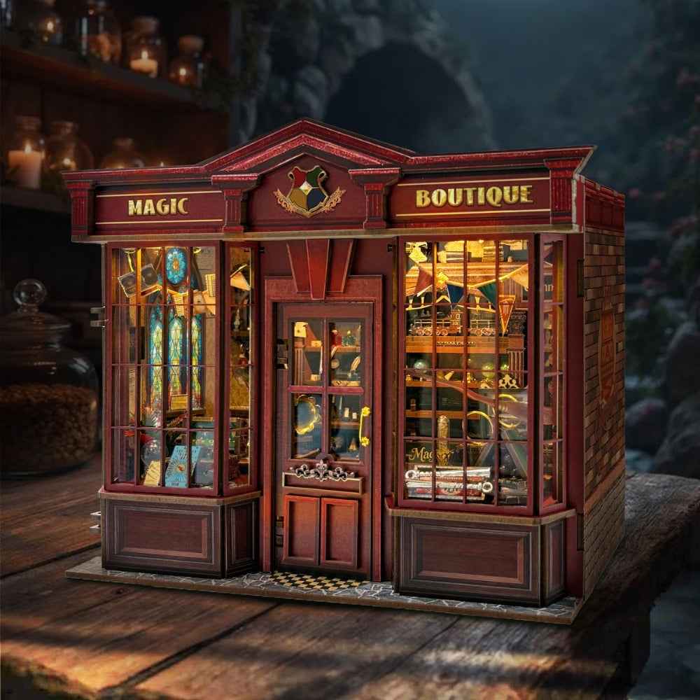 Magic Boutique miniature storefront with burgundy trim, a central door and lit display windows.