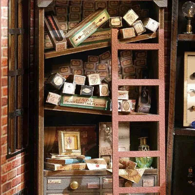 Shelves of miniature wand boxes and a brown ladder inside the Magic House book nook.