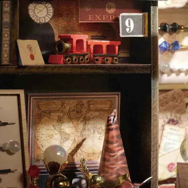 Miniature train on an upper shelf above a map inside Magic House.