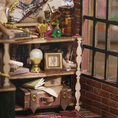 Small shelf with potion bottles, a crystal ball and magical props inside Magic House.