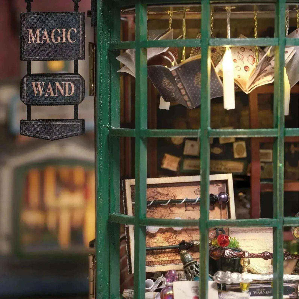Magic House shop window with a Magic Wand sign and an open book suspended above the display.