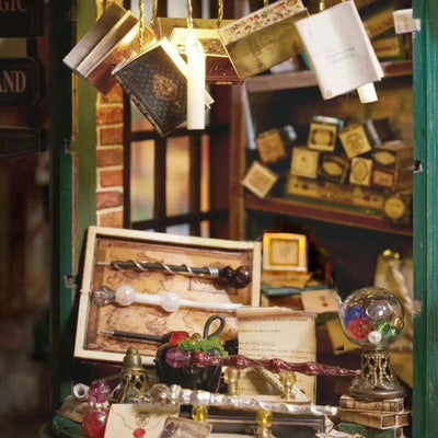 Magic House interior display with miniature wands, bottles and floating books.