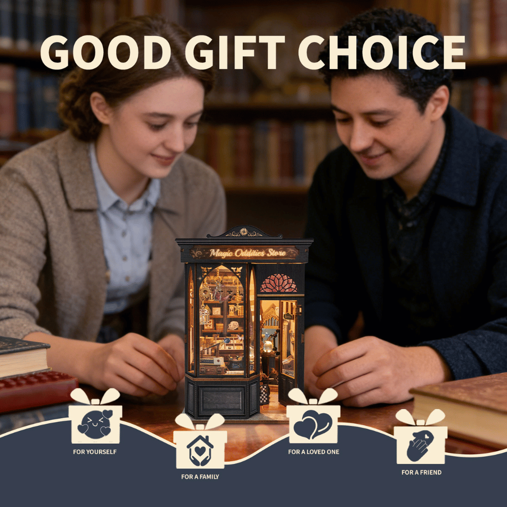 Two adults working on a Magic Oddities Store book nook together.
