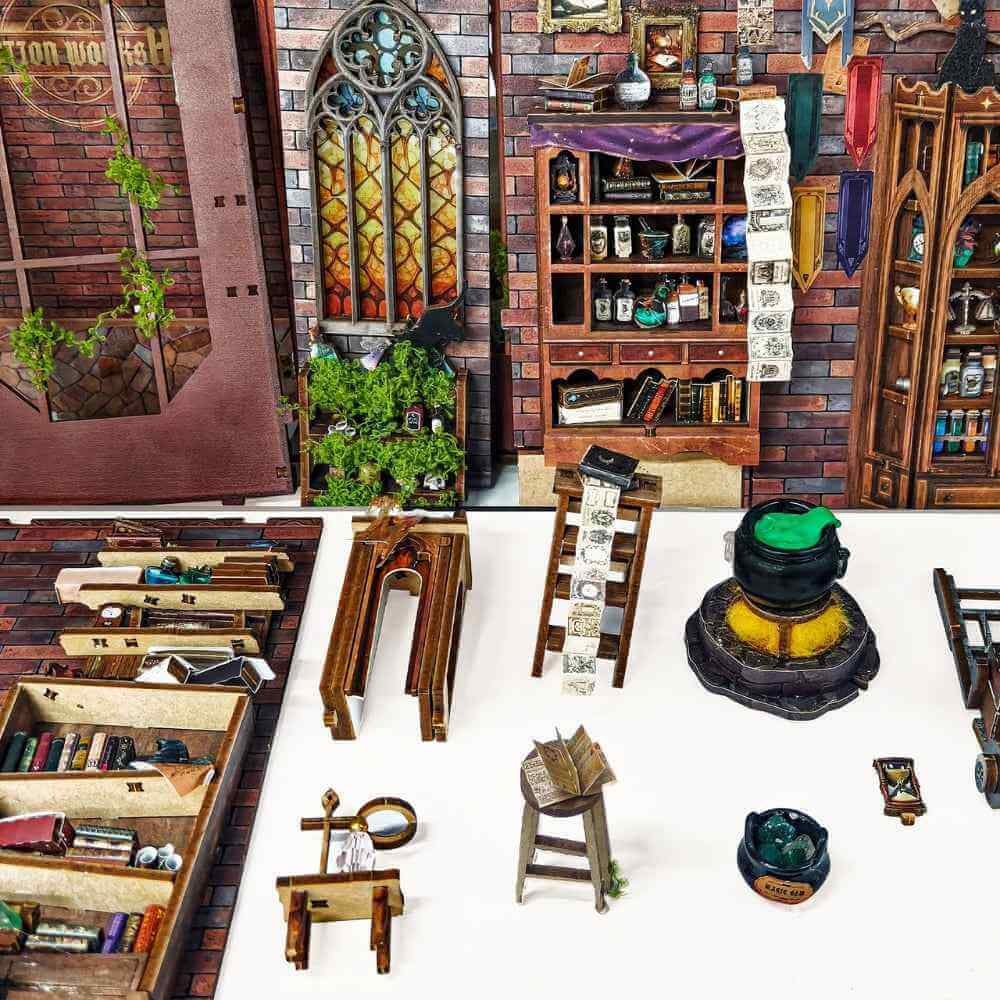 Magic Potion Workshop miniature furniture, cauldron, shelves and wall panels arranged separately.