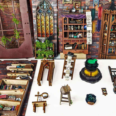 Magic Potion Workshop miniature furniture, cauldron, shelves and wall panels arranged separately.