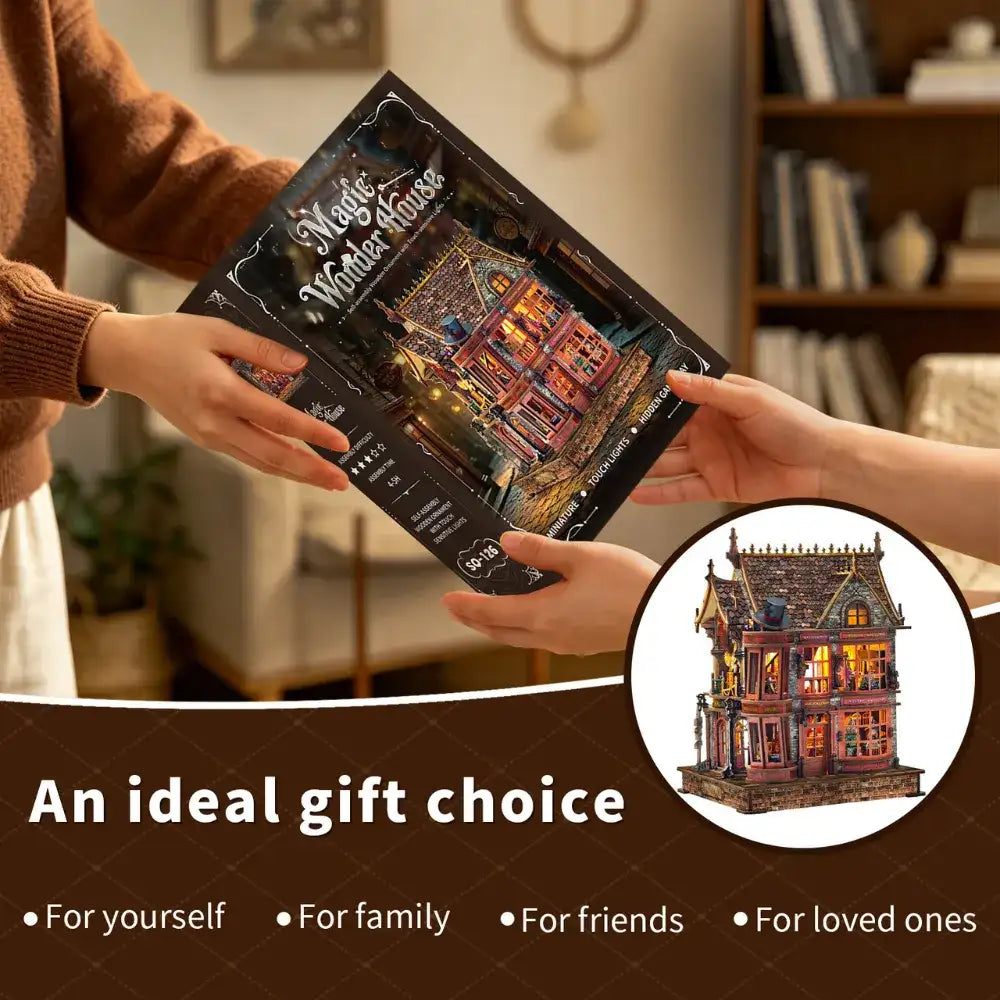 Hands exchanging a Magic Wonder House kit box with the assembled model pictured in an inset.