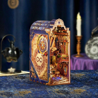Magical Library book nook on blue fabric, with an ornate purple-and-gold exterior.