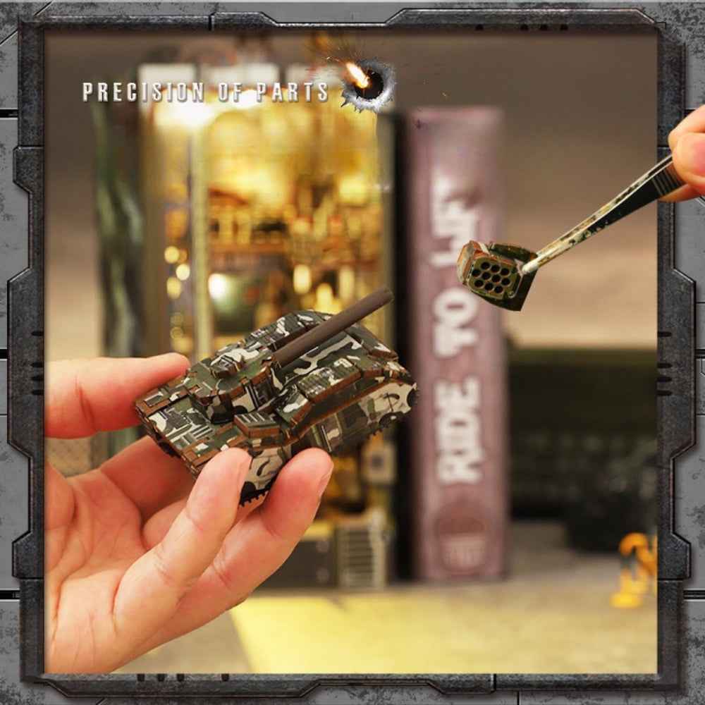 Hands assembling a miniature tank component for the Military Base book nook.