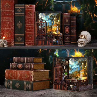Mystic Chamber book nook displayed among books with an illuminated fantasy scene inside.