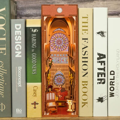 Notre-Dame de Paris book nook between books, with rose windows and miniature cathedral arches.