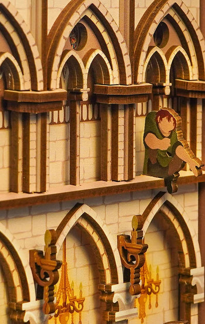 Close-up of vaulted arches and a miniature bell-ringer in the Notre-Dame de Paris book nook.
