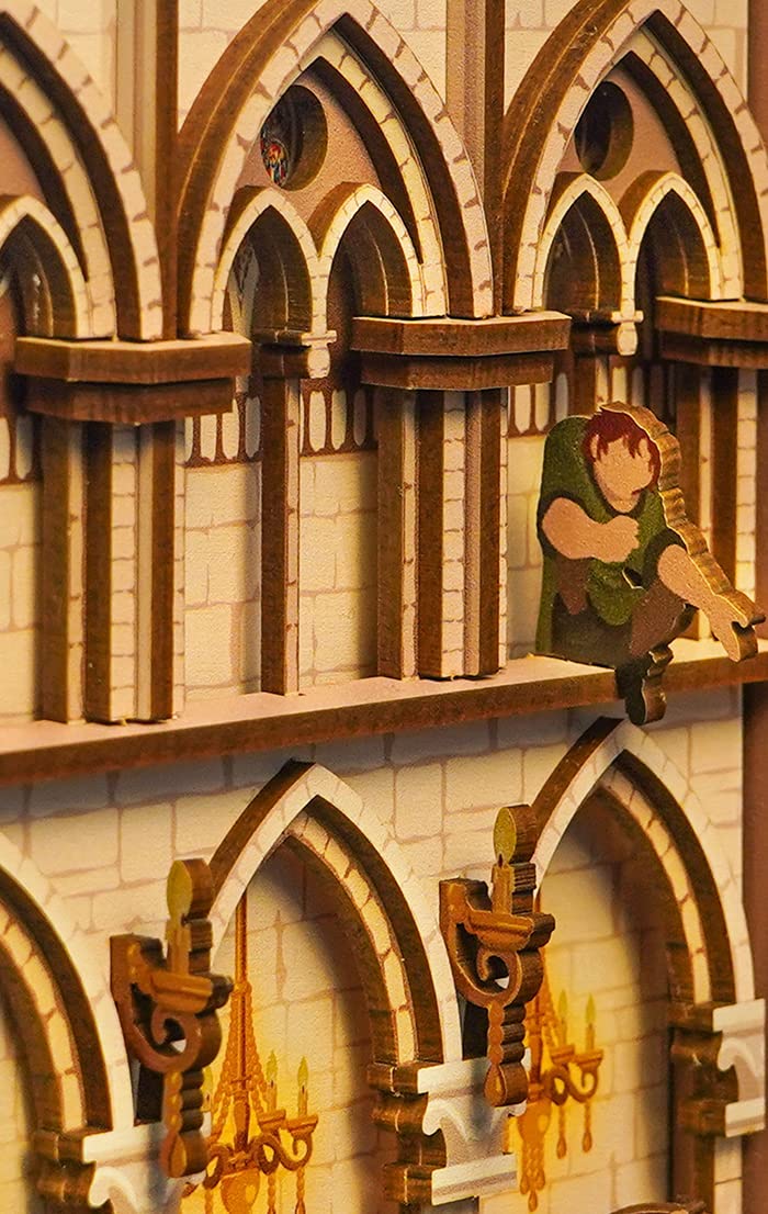 Close-up of vaulted arches and a miniature bell-ringer in the Notre-Dame de Paris book nook.