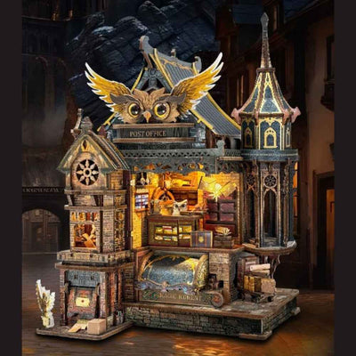 Owl Post Office miniature building with a large golden owl above the roof and tiny parcels inside.
