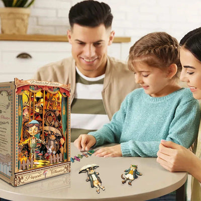 Family assembling Puppet Theater character pieces beside the completed book nook.