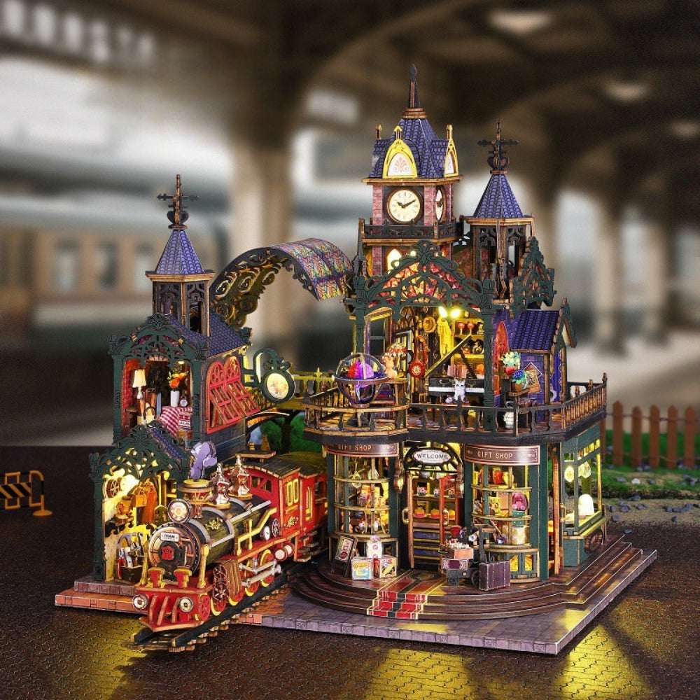 Rail-track Secluded City miniature railway scene with a red locomotive and illuminated clock tower.