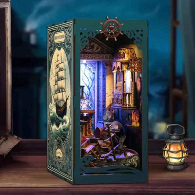 Riddle on the Seabed book nook with a ship-themed cover, miniature stone arches and blue lighting.