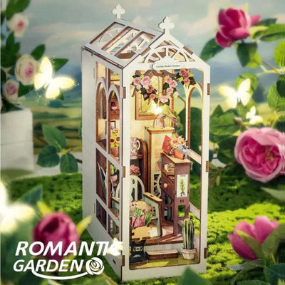 Romantic Garden white greenhouse book nook surrounded by flowers and butterfly decorations.