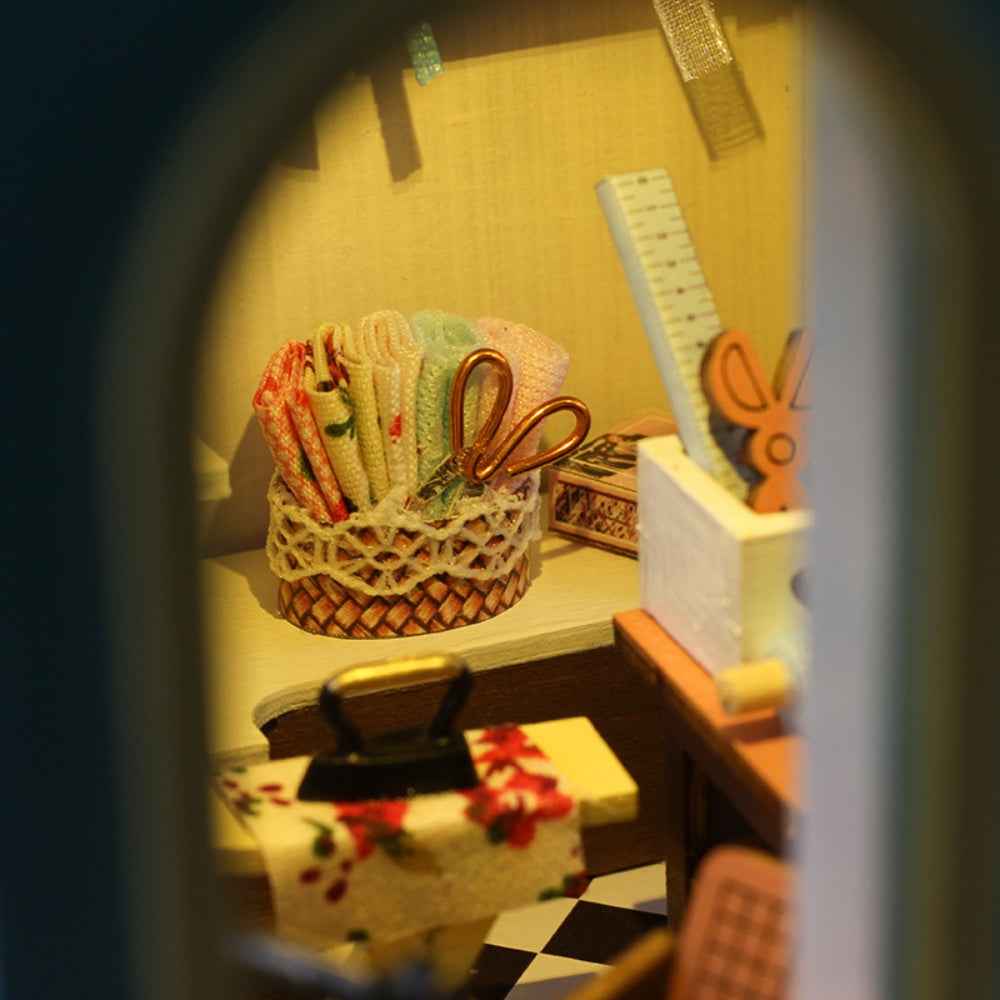 Tailor Shop close-up of miniature scissors, rulers and sewing tools in baskets.