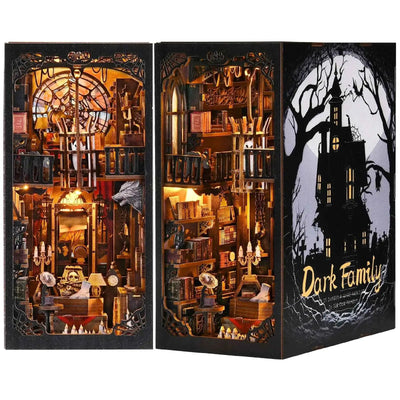 The Dark Family book nook from two angles, showing its Gothic interior and haunted-house cover.