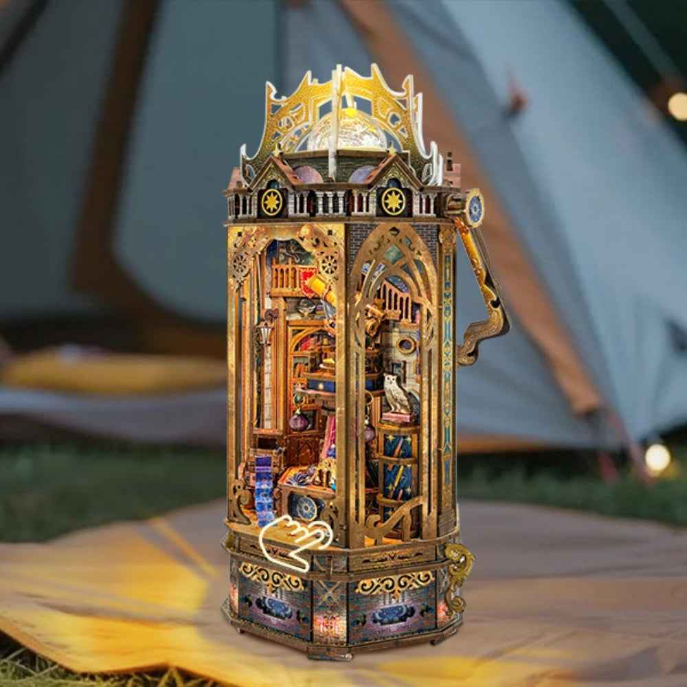 The Lantern of Galaxy ornate lantern-shaped miniature with gold trim and glowing interior scenes.