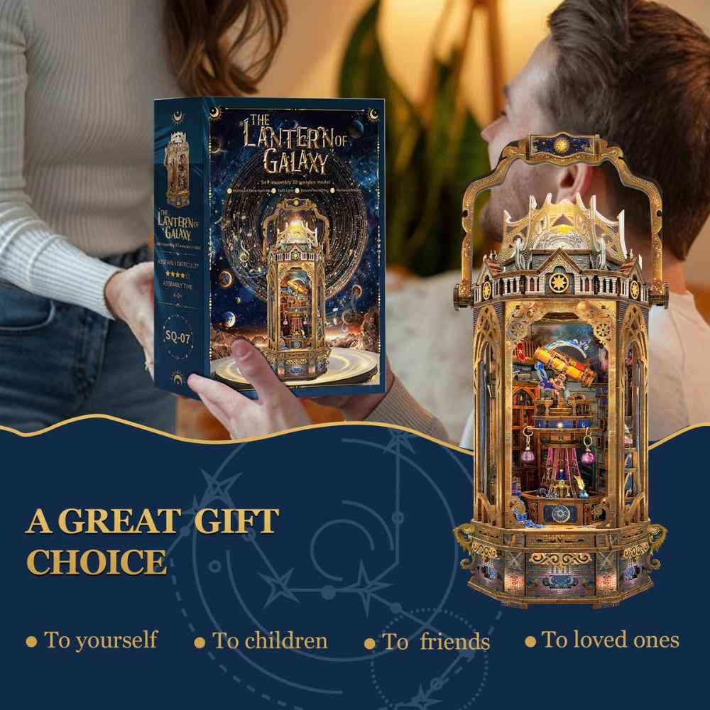 Person presenting The Lantern of Galaxy kit box beside the completed lantern model.