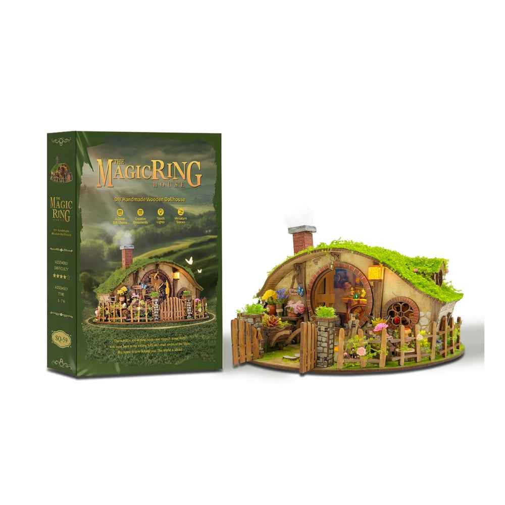 The Magic Ring House miniature cottage beside its green illustrated kit box.