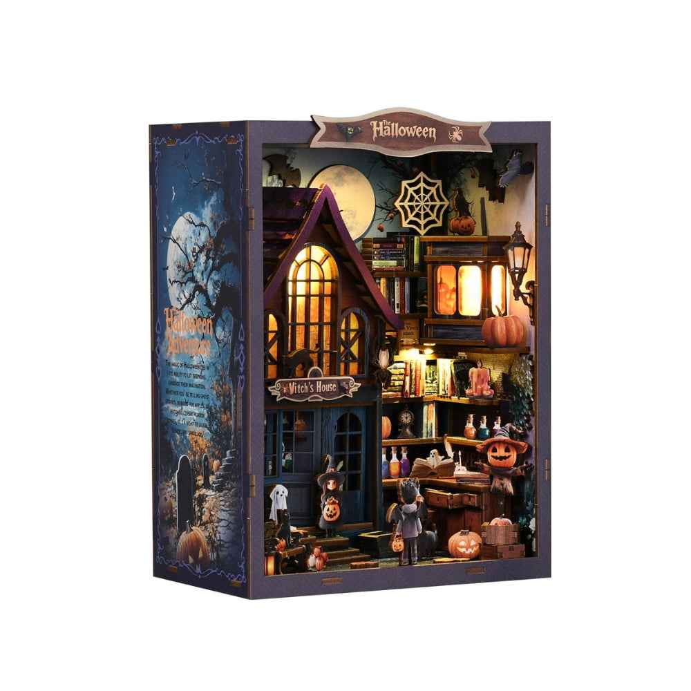 Angled view of The Magical Night at the Castle showing miniature potions, pumpkins and a witch's house.