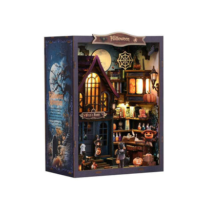 Angled view of The Magical Night at the Castle showing miniature potions, pumpkins and a witch's house.