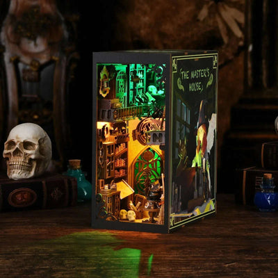 The Monster's House book nook with a green-lit upper room and an open illustrated cover.