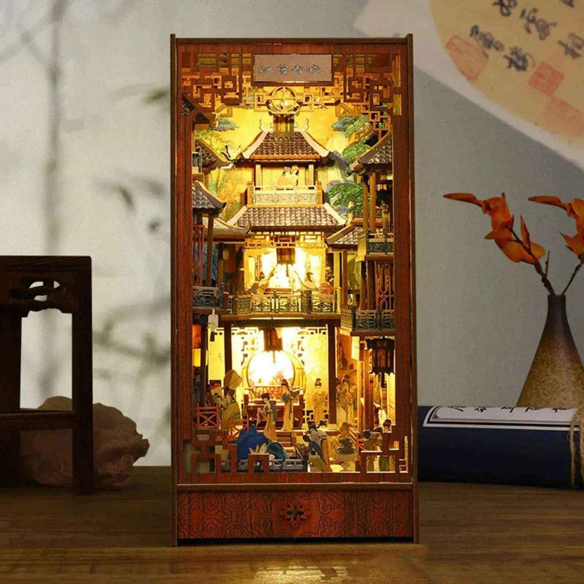 Illuminated Imperial Court in Han China book nook with layered palace roofs and miniature figures.