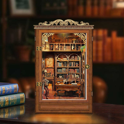 Time Book House book nook with an ornate cabinet-style frame and miniature reading room.