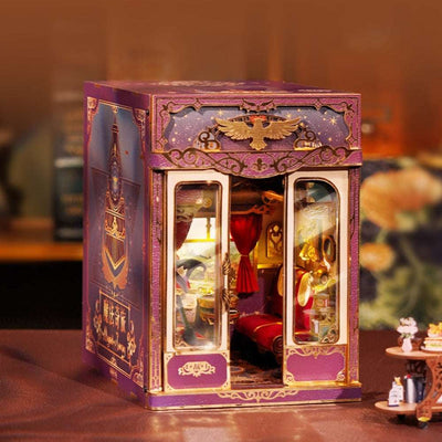 Magical Journey train cabin model with purple-and-gold trim and glazed-style doors.