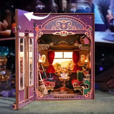 Magical Journey train cabin with its door open to reveal red curtains and miniature seating.