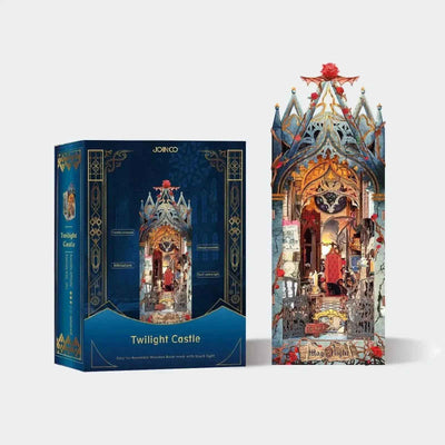 Completed Twilight Castle book nook beside its illustrated kit packaging.