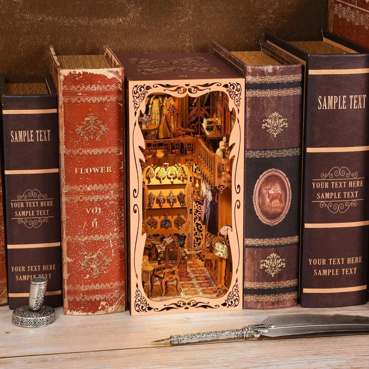 Wardrobe of Duchess book nook between books with an ornate cream frame and miniature clothes inside.